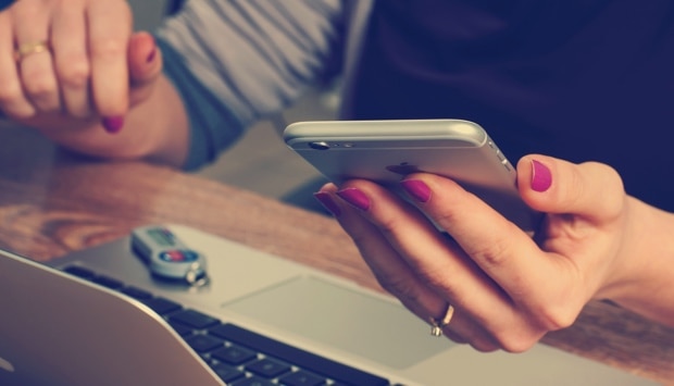 women checking phone