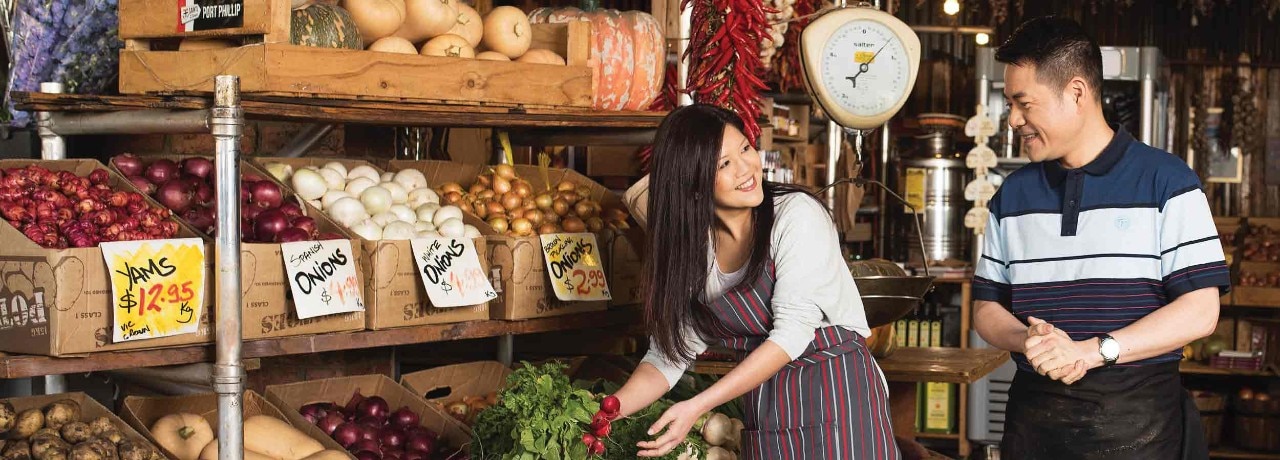 couple working at a green grocer