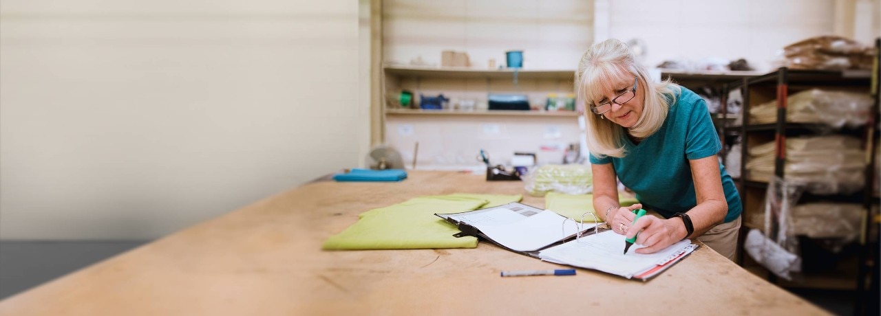 woman-writing-desk-DigBan-2500x900.jpg