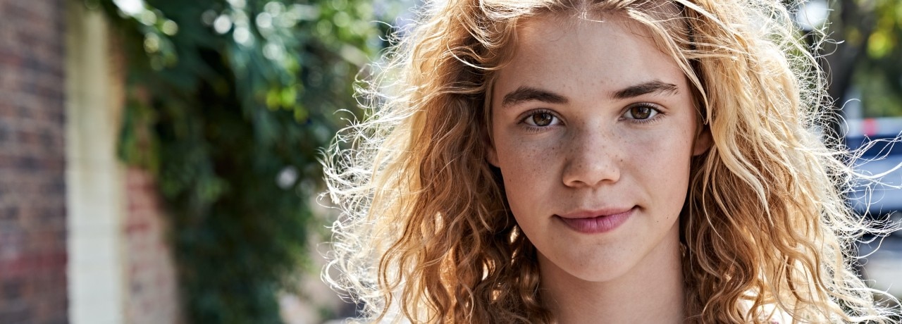 Young woman smiling.