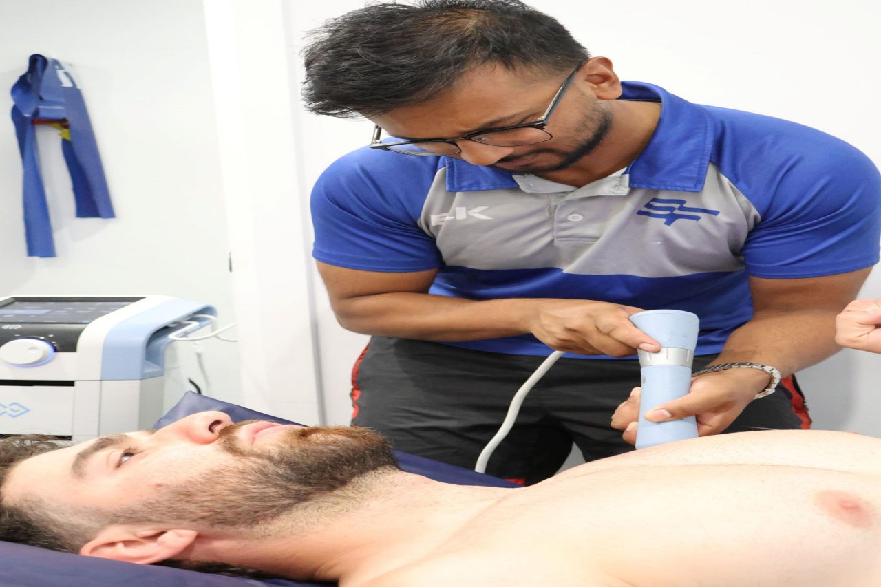 SportsFit Health and Rehab founder and sports physiotherapist Jay Kasthuri treating a patient